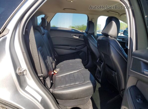 2FMPK4J99RBA67748 2024 FORD EDGE Silver Widok wnętrza z tyłu