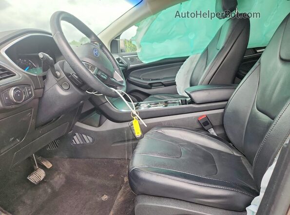 2FMPK4K97KBB93255 2019 FORD EDGE Зеленый Вид салона спереди
