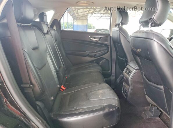 2FMPK4K9XHBB75664 2017 FORD EDGE Black Вид задньої частини салону