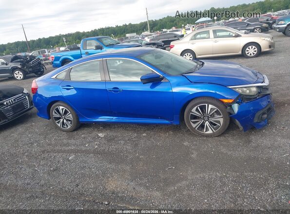 2HGFC1F74GH657872 2016 HONDA CIVIC Синий Вид задней части салона