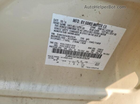 2LMHJ5AT6GBL02634 2016 LINCOLN MKT Cream Widok naklejki z numerem VIN