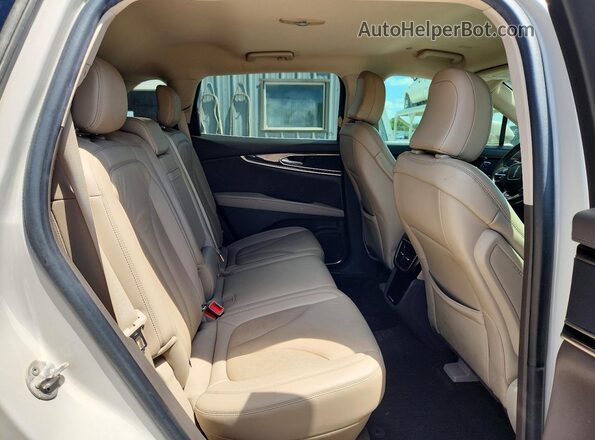 2LMPJ6J99MBL19171 2021 LINCOLN NAUTILUS Tan Vista interior trasera