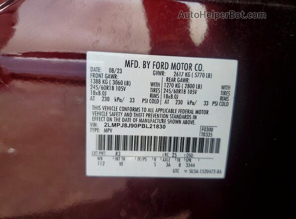 2LMPJ8J90PBL21830 2023 LINCOLN NAUTILUS Burgundy Widok naklejki z numerem VIN