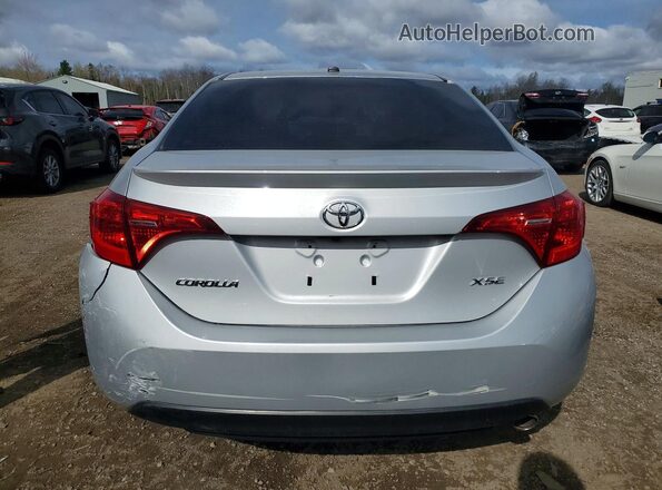2T1BURHE1JC103713 2018 TOYOTA COROLLA Silver Rear view