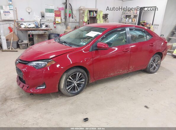 2T1BURHE2HC912146 2017 TOYOTA COROLLA Burgundy Vista tres cuartos delantera izquierda