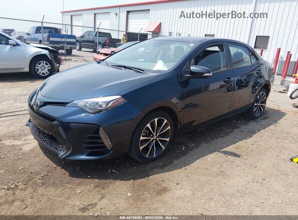 2T1BURHE2JC010022 2018 TOYOTA COROLLA Dark Blue Vista tres cuartos delantera izquierda
