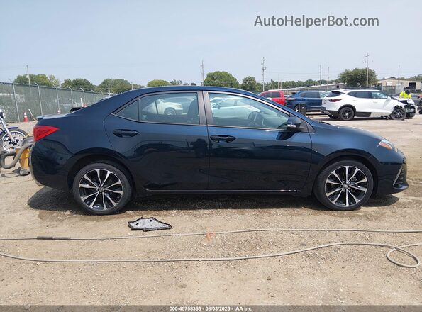 2T1BURHE2JC010022 2018 TOYOTA COROLLA Dark Blue Vista interior trasera