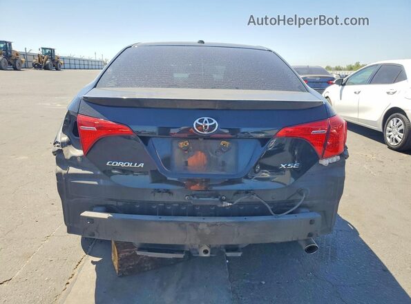 2T1BURHE2KC176820 2019 TOYOTA COROLLA Black Rear view