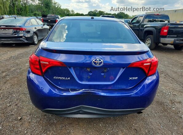 2T1BURHE3JC996869 2018 TOYOTA COROLLA Синий Вид сзади