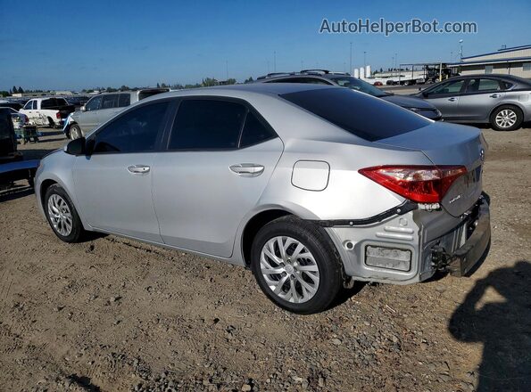 2T1BURHE4JC043197 2018 TOYOTA COROLLA Silver Trasero izquierdo