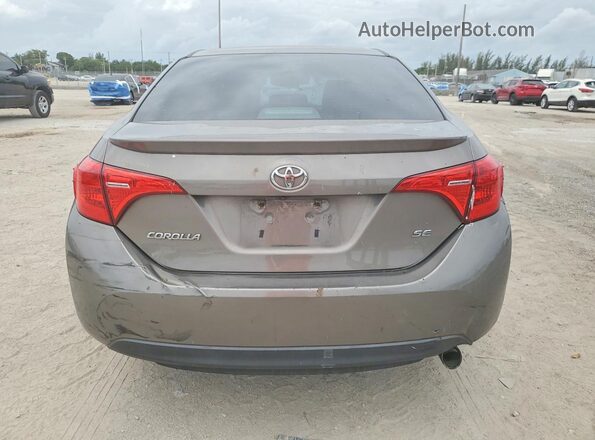 2T1BURHE6JC014977 2018 TOYOTA COROLLA Brown Rear view