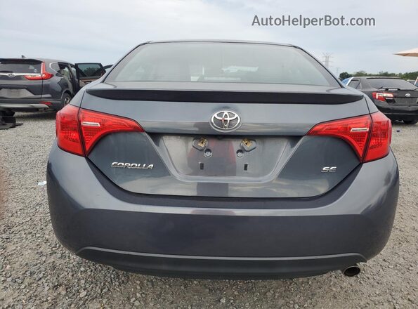 2T1BURHE7JC067610 2018 TOYOTA COROLLA Gray Vista trasera