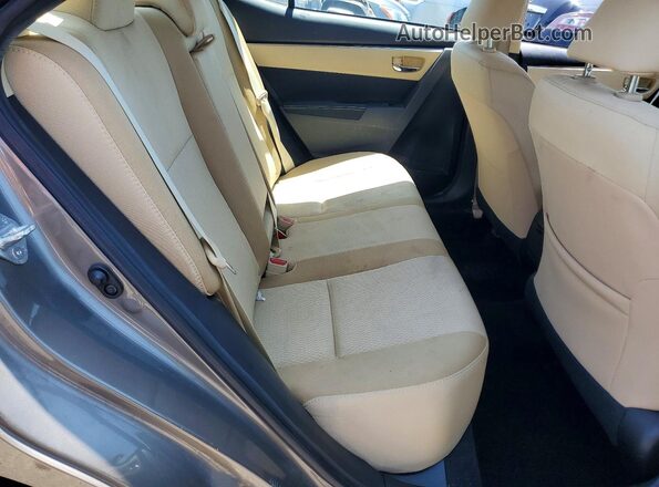 2T1BURHE8HC852440 2017 TOYOTA COROLLA Tan Vista de los asientos traseros