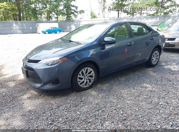 2T1BURHE9HC814747 2017 TOYOTA COROLLA Gray Vista tres cuartos delantera izquierda