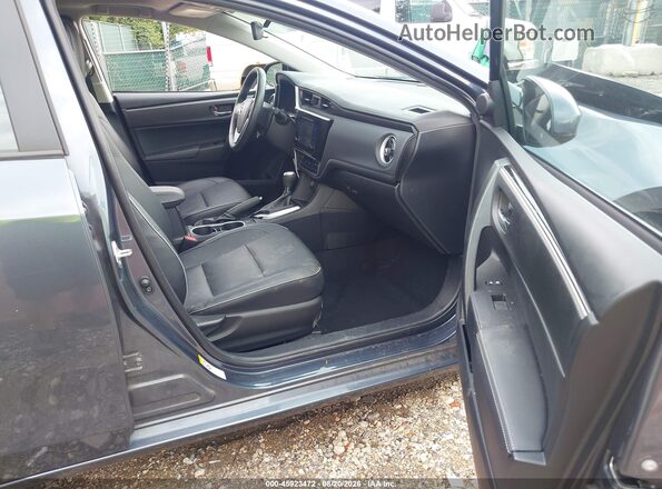 2T1BURHE9JC001723 2018 TOYOTA COROLLA Blue Widok wnętrza z przodu