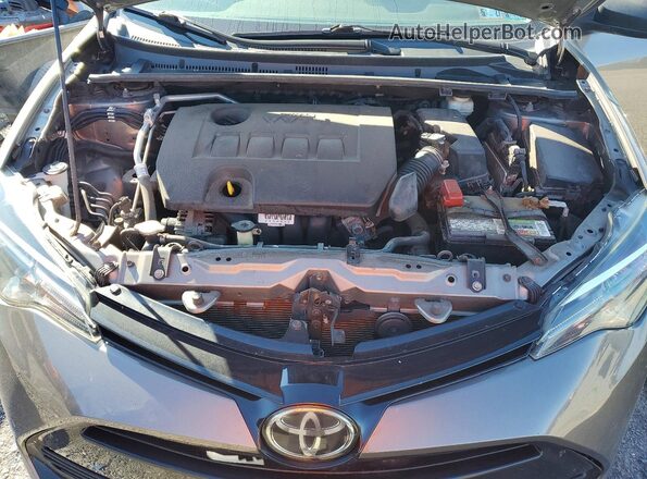 2T1BURHE9JC067818 2018 TOYOTA COROLLA Charcoal Vista interior trasera