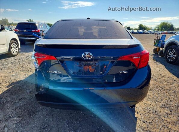 2T1BURHE9JC967859 2018 TOYOTA COROLLA Синий Вид сзади