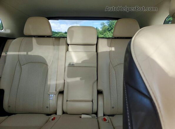 2T2BZMCA2GC025469 2016 LEXUS RX Beige Vista de los asientos traseros