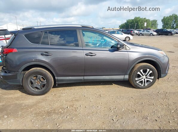 2T3BFREV1HW592113 2017 TOYOTA RAV4 Серый Вид задней части салона