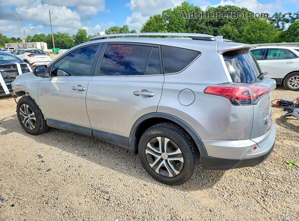 2T3BFREV2GW520450 2016 TOYOTA RAV4 Silver Trasero izquierdo
