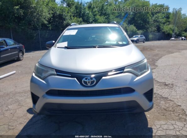 2T3BFREV3GW417988 2016 TOYOTA RAV4 Silver Rear interior view