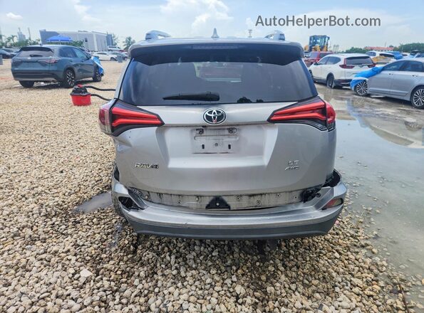 2T3BFREV3GW445077 2016 TOYOTA RAV4 Silver Widok wnętrza z tyłu