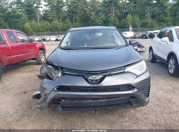 2T3BFREV7JW855243 2018 TOYOTA RAV4 Gray Rear interior view