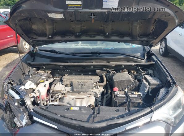 2T3BFREV7JW855243 2018 TOYOTA RAV4 Gray Rear view