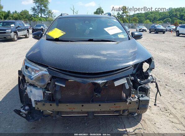 2T3JFREV1HW596934 2017 TOYOTA RAV4 Black Rear interior view