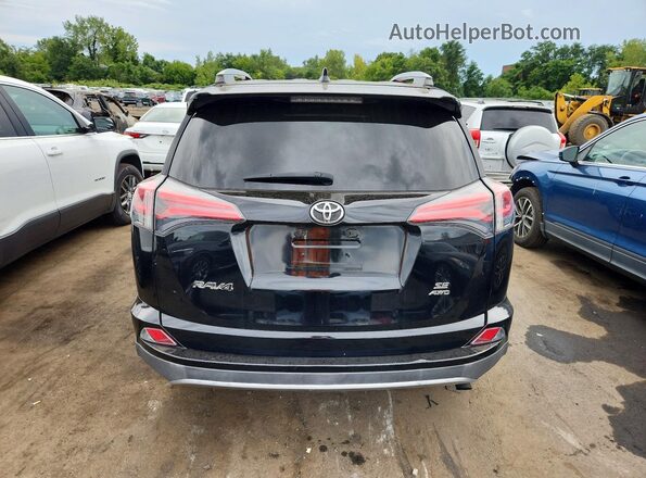2T3JFREV1JW768871 2018 TOYOTA RAV4 Black Հետևի տեսք