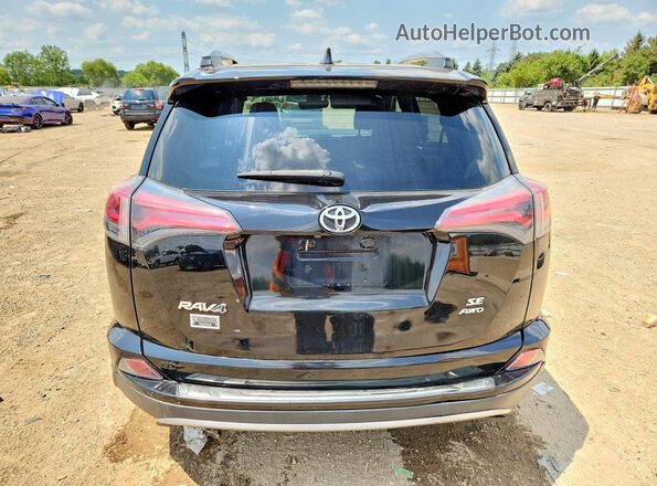 2T3JFREVXJW785698 2018 TOYOTA RAV4 Черный Вид сзади