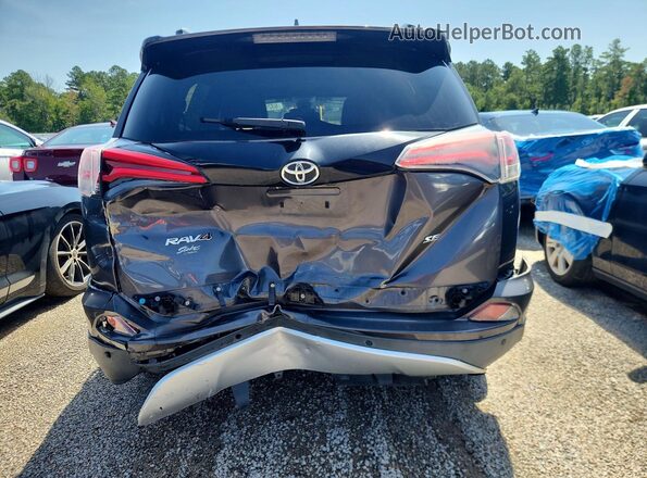2T3NFREV2GW310010 2016 TOYOTA RAV4 Gray Vista trasera
