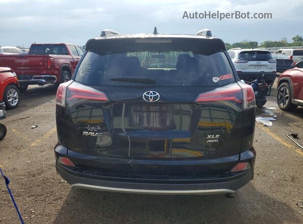 2T3RFREV1GW535844 2016 TOYOTA RAV4 Black Rear view