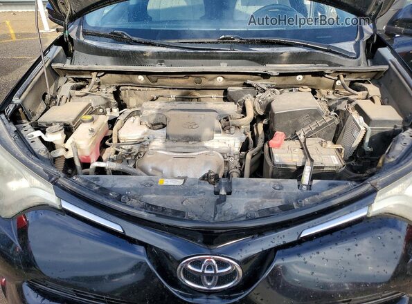 2T3RFREV1GW535844 2016 TOYOTA RAV4 Black Rear interior view