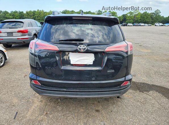 2T3RFREV1JW749482 2018 TOYOTA RAV4 Черный Вид сзади