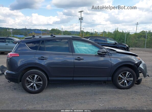 2T3RFREV3HW593598 2017 TOYOTA RAV4 Gray Widok wnętrza z tyłu