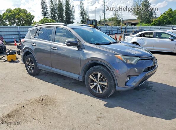 2T3RFREV3JW749869 2018 TOYOTA RAV4 Серый Передняя правая четверть