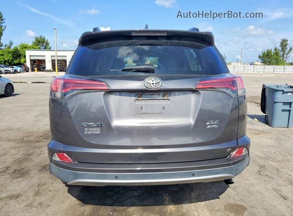 2T3RFREV3JW749869 2018 TOYOTA RAV4 Серый Вид сзади