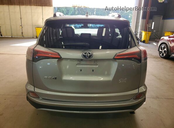 2T3RFREV3JW796397 2018 TOYOTA RAV4 Silver Vista trasera