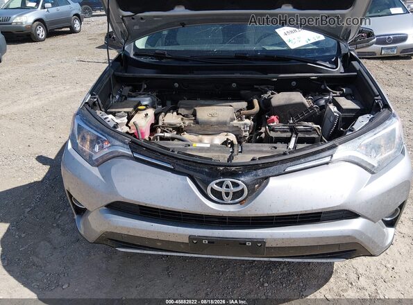 2T3RFREV4GW411602 2016 TOYOTA RAV4 Silver Rear view