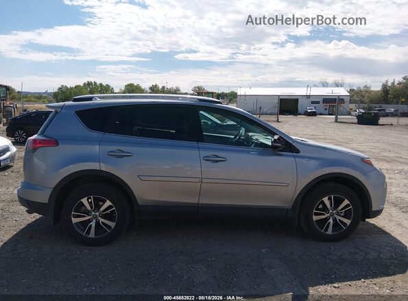 2T3RFREV4GW411602 2016 TOYOTA RAV4 Silver Rear interior view