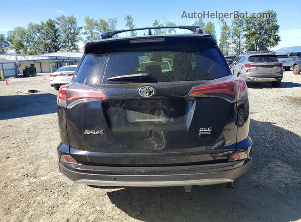 2T3RFREV4JW745944 2018 TOYOTA RAV4 Black უკანა ხედი