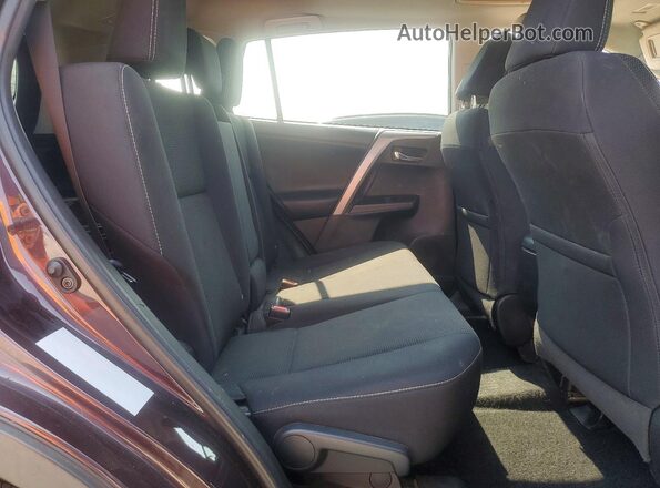 2T3RFREV6JW797219 2018 TOYOTA RAV4 Purple Vista interior trasera