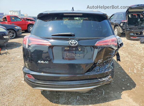 2T3RFREV7JW799416 2018 TOYOTA RAV4 Black უკანა ხედი