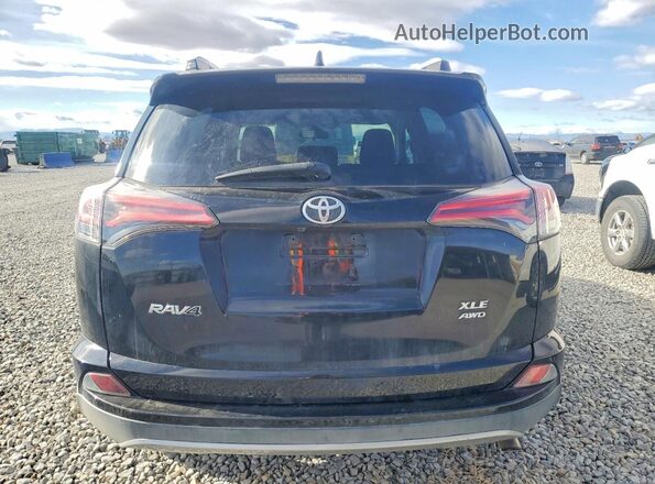 2T3RFREV9JW716570 2018 TOYOTA RAV4 Black Rear view