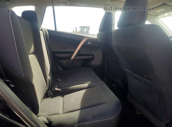 2T3RFREV9JW716570 2018 TOYOTA RAV4 Black Rear interior view