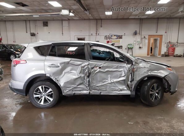 2T3RFREV9JW789566 2018 TOYOTA RAV4 Silver უკანა სალონის ხედი