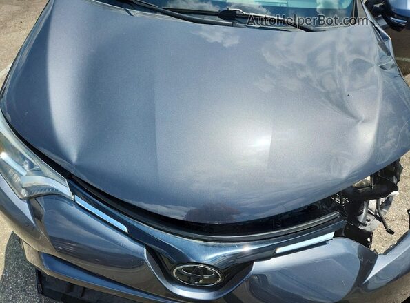 2T3RFREVXJW851623 2018 TOYOTA RAV4 Gray უკანა სალონის ხედი