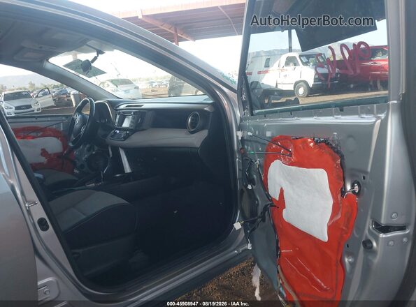 2T3WFREV1GW279384 2016 TOYOTA RAV4 Серый Вид салона спереди
