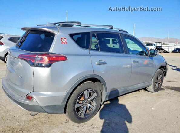 2T3WFREV1GW296511 2016 TOYOTA RAV4 Silver Rear view